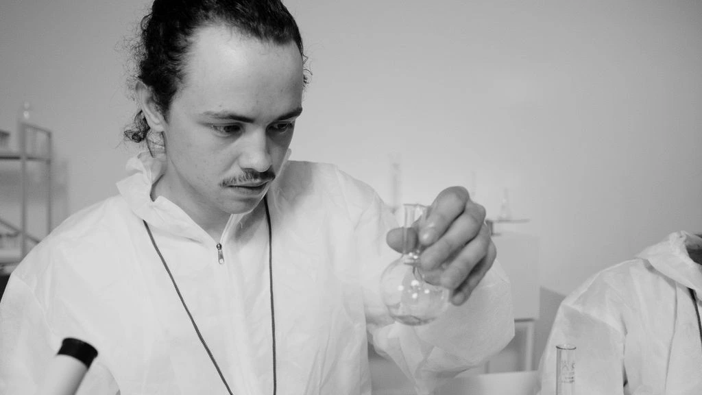 A behavioral scientist reviewing habituation curves in a Boston research lab.
